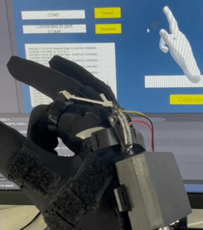 Data glove in use with Unity hand visualization on screen